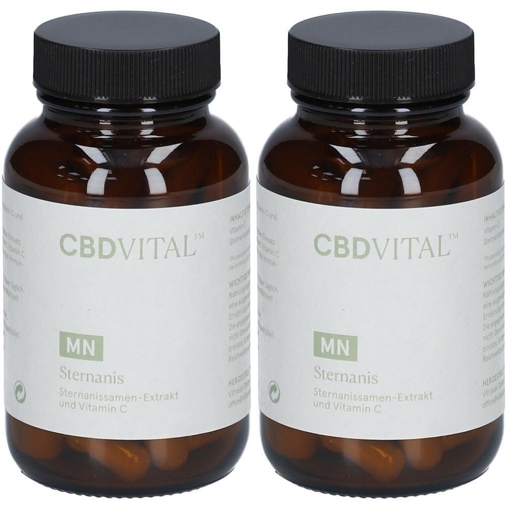 Zwei braune Glasflaschen mit schwarzen Deckeln, gefüllt mit Sternanis-Kapseln und Vitamin C.