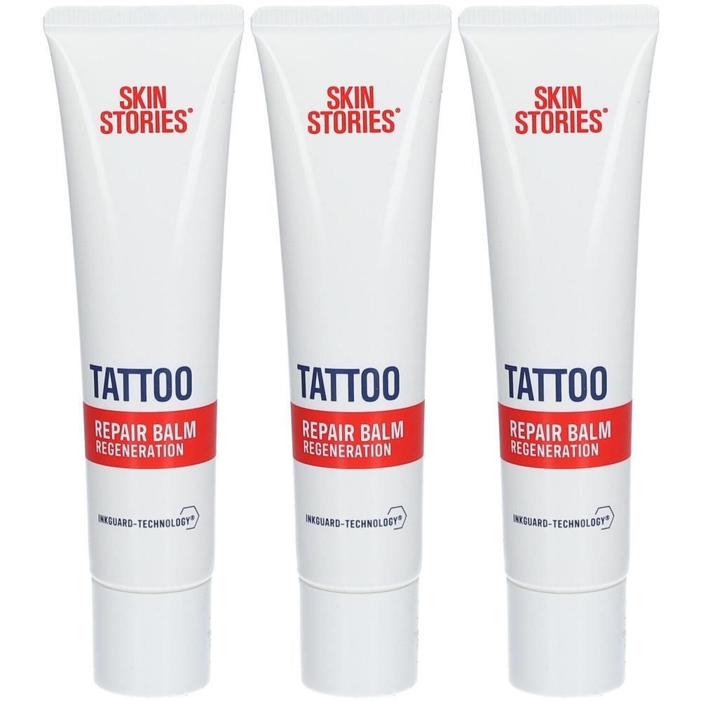 Drei weiße Tuben mit SKIN STORIES TATTOO REPAIR BALM REGENERATION und INKGUARD-TECHNOLOGY.
