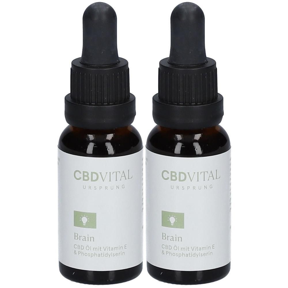 Zwei Flaschen CBD Öl mit Pipettenverschluss. Etikett zeigt "CBDVITAL URSPRUNG Brain" und "CBD Öl mit Vitamin E & Phosphatidylserin".