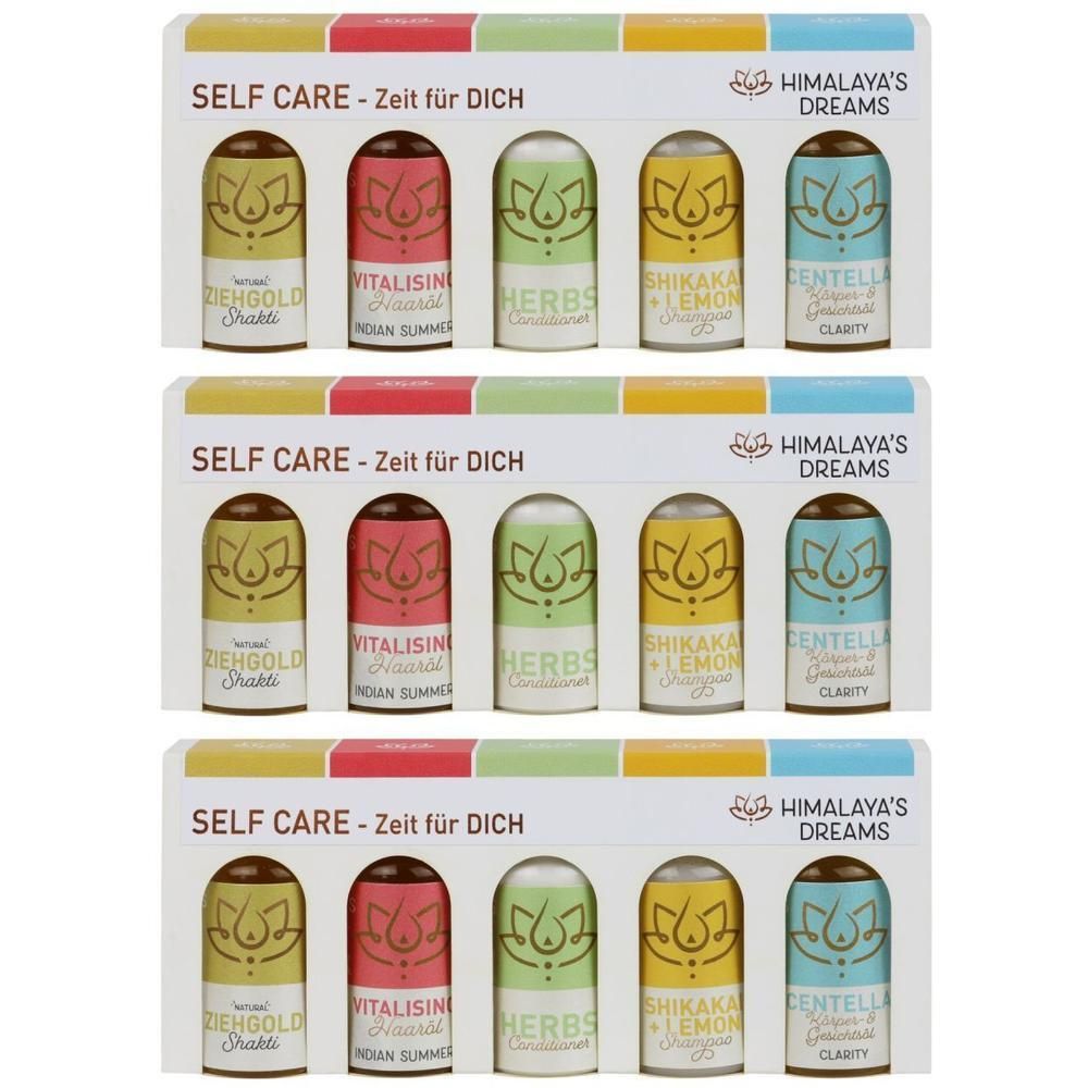 Drei Packungen mit je fünf kleinen Flaschen HIMALAYA'S DREAMS Self Care Produkten.