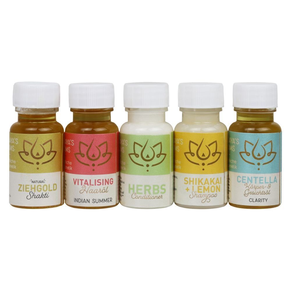 Fünf kleine Fläschchen mit Selbstpflegeprodukten von Himalaya's Dreams in Gelb, Rosa, Grün, Gelb und Blau.