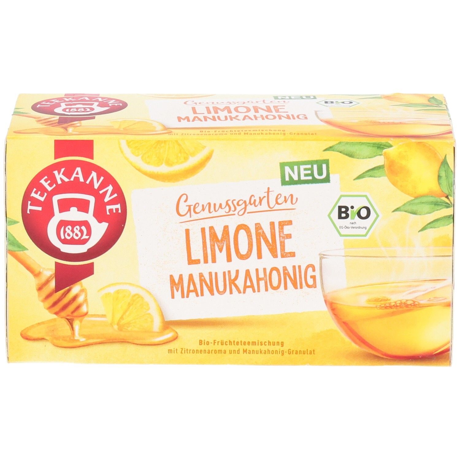 Teekanne BIO Genussgarten Limone Manukahonig Tee-Verpackung mit Tasse Tee und Zitronen.
