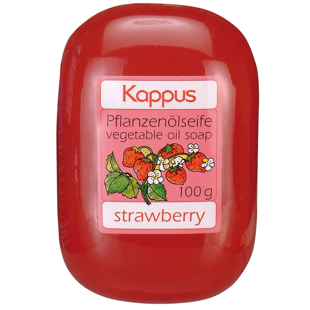Rote Seife mit Etikett. Aufschrift: Kappus Pflanzenölseife, Erdbeere. Abbildung von Erdbeeren. Gewicht: 100 g.