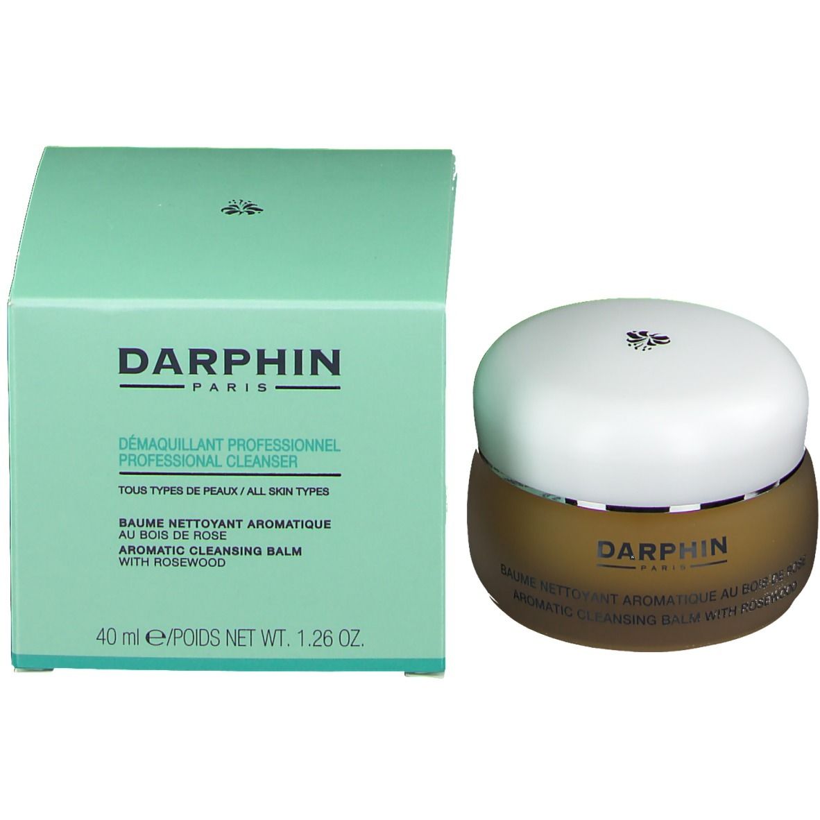 Produkt und Verpackung. Brauner Tiegel mit weißem Deckel und grüne Schachtel. Aufschrift: Darphin, Cleanser.