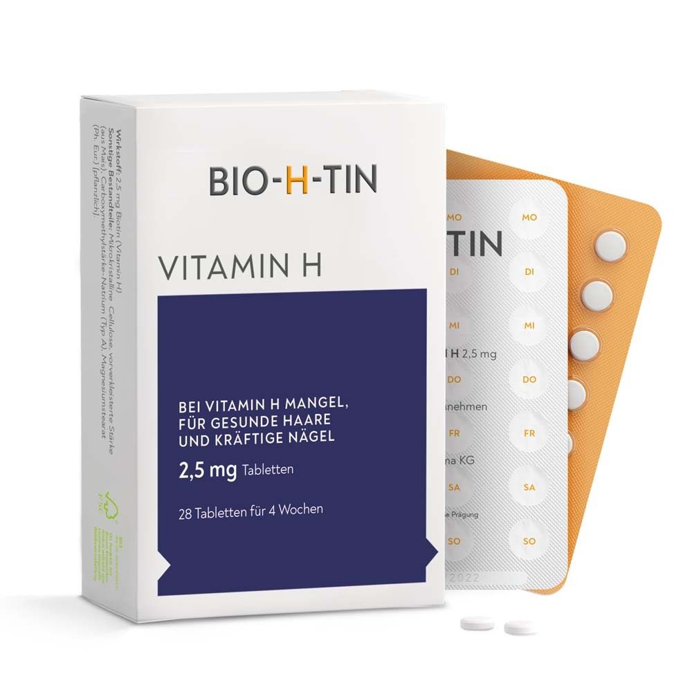 BIO-H-TIN Vitamin H Packung und Tabletten. Blaue Fläche mit Text. 28 Tabletten für 4 Wochen. Weiße Tabletten.