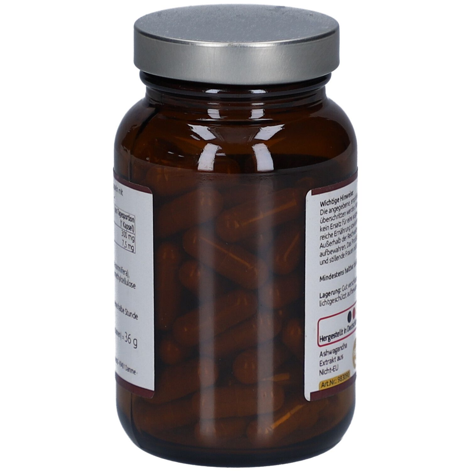 Braune Glasflasche mit silbernem Deckel. Kapseln sichtbar. Text auf Etikett.