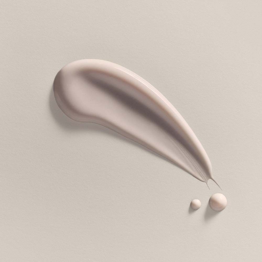 Creme-Probe. Hellrosa. Zwei Tropfen. Hintergrund hell.