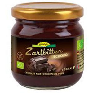 Glas mit Schoko-Zartbitter-Creme. Goldfarbener Deckel. Etikett mit Produktname, Schokoladenstück und Vegan-Logo.