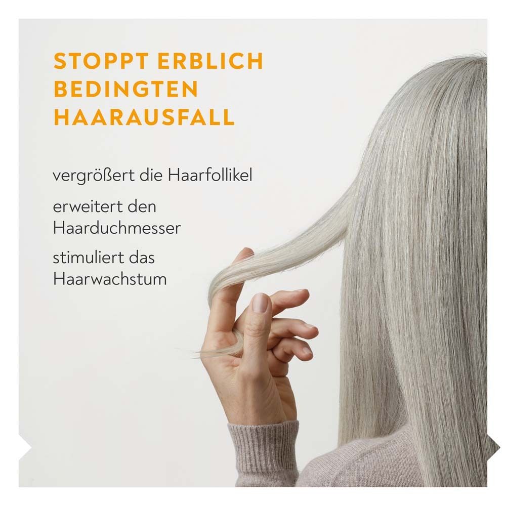 Text: Stoppt erblich bedingten Haarausfall. Vergrößert Haarfollikel, erweitert Haardurchmesser, stimuliert Haarwachstum.