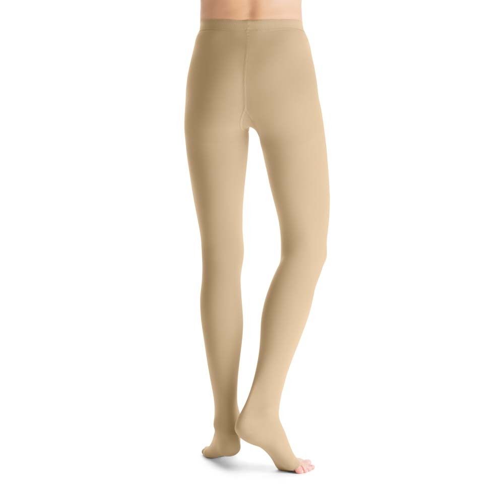 Naturfarbene Kompressionsstrumpfhose mit offenem Zehenbereich. Blick von der Seite.