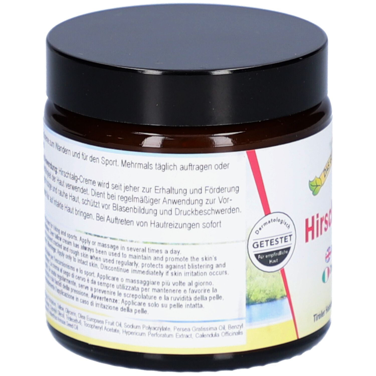 Rückseite eines braunen Tiegels mit schwarzem Deckel. Text auf dem Etikett.