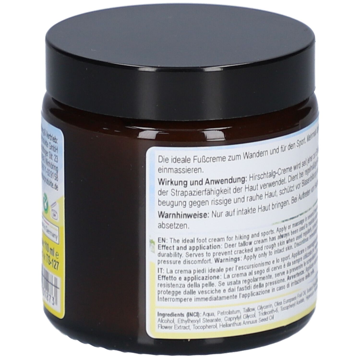 Seite eines braunen Tiegels mit schwarzem Deckel. Text auf dem Etikett.