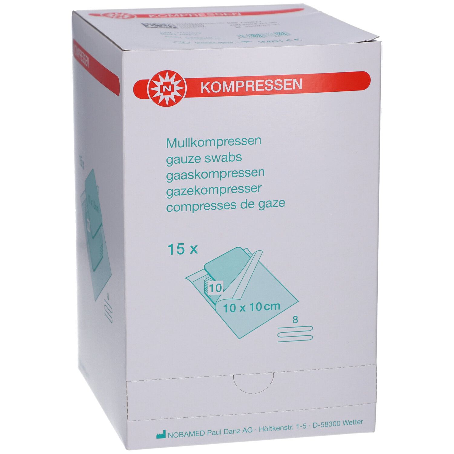 Weißer Karton mit roter Beschriftung. Aufdruck: Mullkompressen, 15 Stück, 10x10 cm. Marke: NOBAMED.