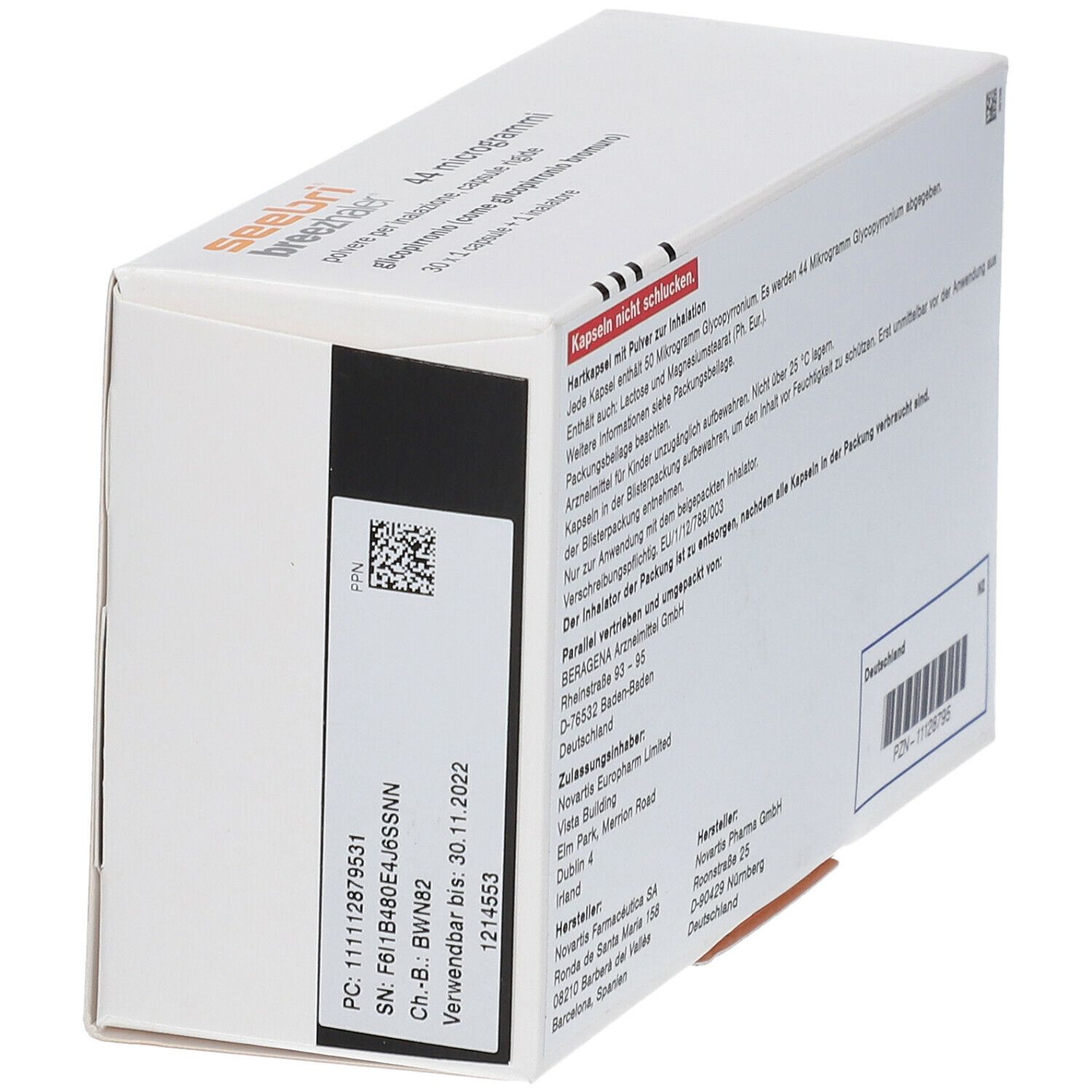 Weiße rechteckige Verpackung mit Text. Aufdrucke: "Hartkapsel mit Pulver zur Inhalation". Barcode und weitere Informationen.