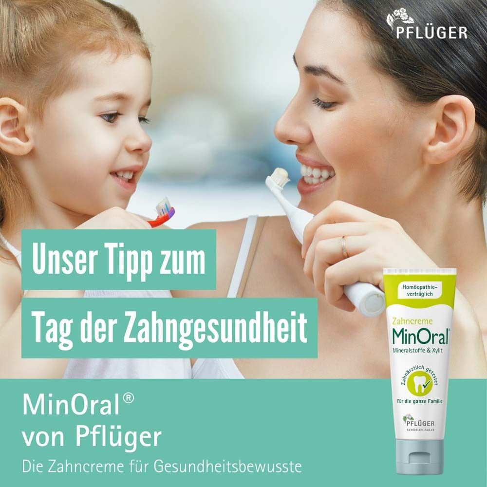 Werbung mit Mutter und Kind beim Zähneputzen. MinOral-Tube rechts unten. Text: "Unser Tipp zum Tag der Zahngesundheit".
