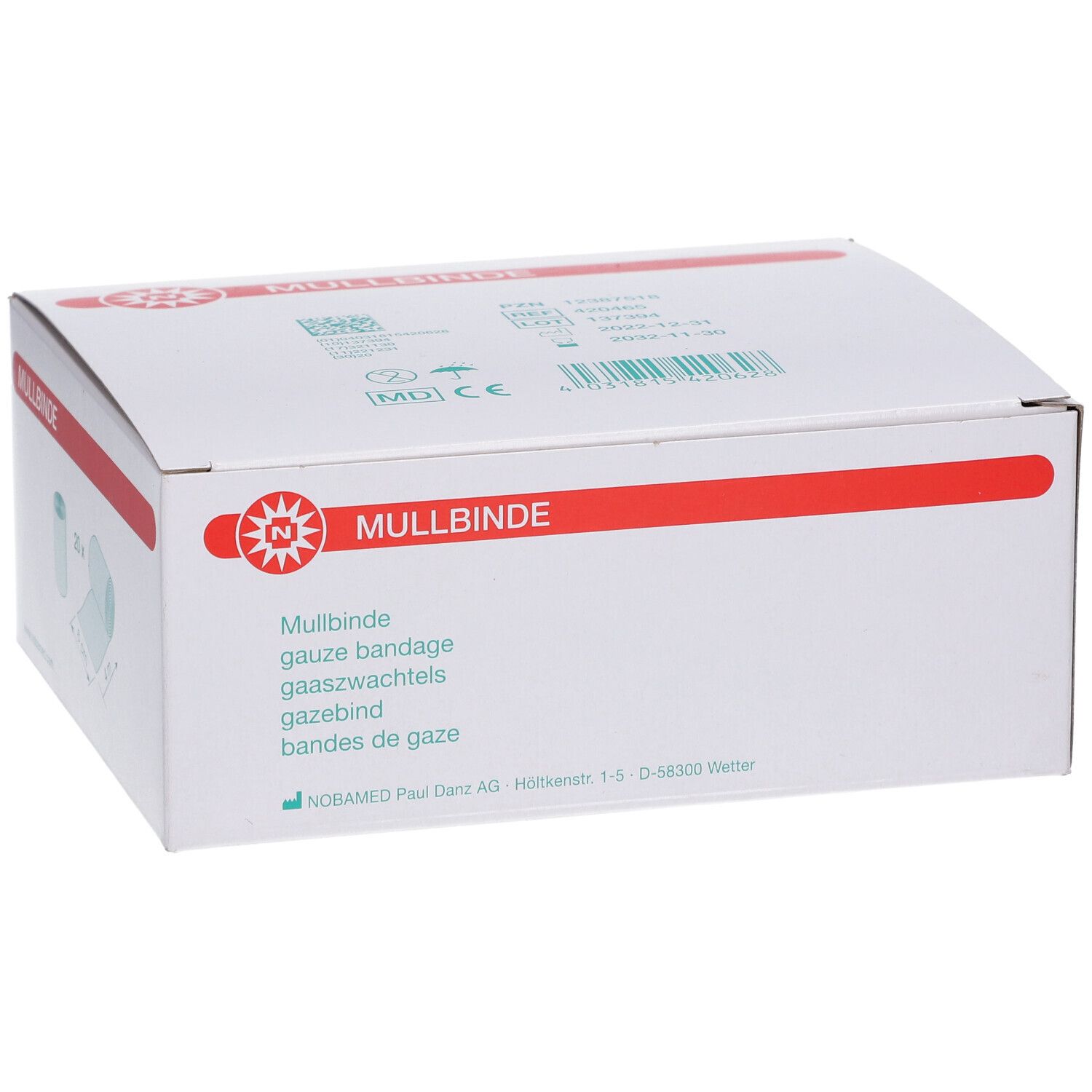 Weiße Verpackung mit rotem Streifen und 'Mullbinde'. Produktbezeichnung in verschiedenen Sprachen. Gaze-Bandage.