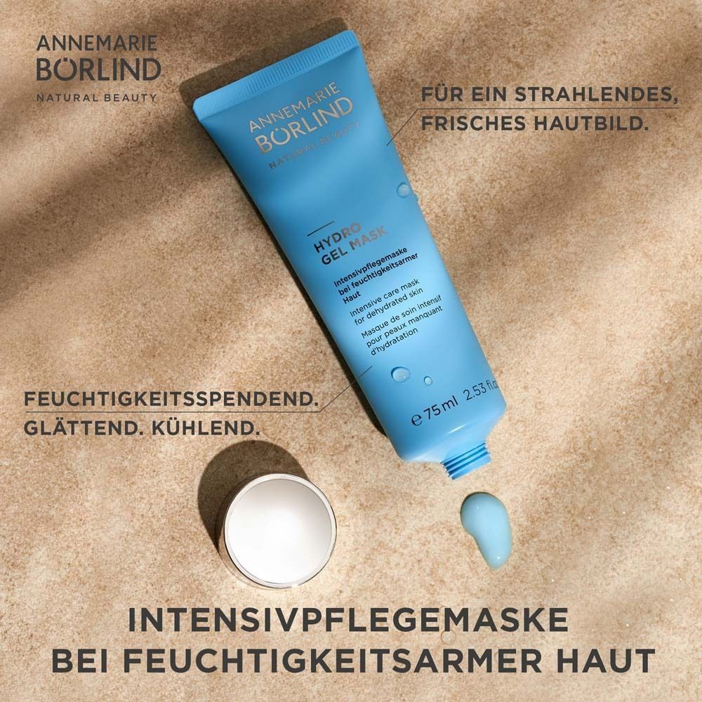 Hellblaue Tube mit silbernem Deckel. Aufschrift: ANNEMARIE BÖRLIND, HYDRO GEL MASK. Daneben ein offener Deckel und Gel.
