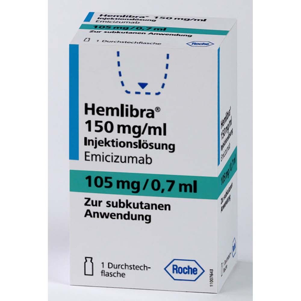 Weiße Faltschachtel mit blauen Akzenten. Beschriftung: Hemlibra 150 mg/ml Injektionslösung, 105 mg/0,7 ml. Roche-Logo. 1 Durchstechflasche.