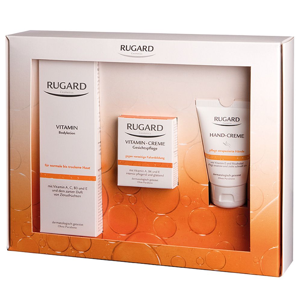 Geschenkbox mit drei RUGARD-Produkten: Bodylotion, Gesichtscreme und Handcreme. Weiße Verpackung mit Sichtfenster.
