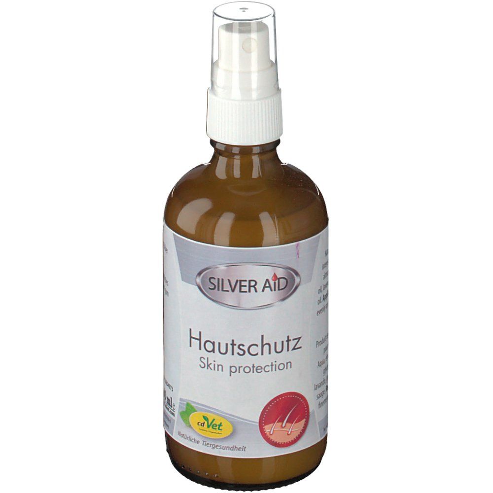 Braune Glasflasche mit Sprühkopf. Etikett mit "SILVER AID Hautschutz Skin protection". Logo: roter Kreis mit Haarsymbol.