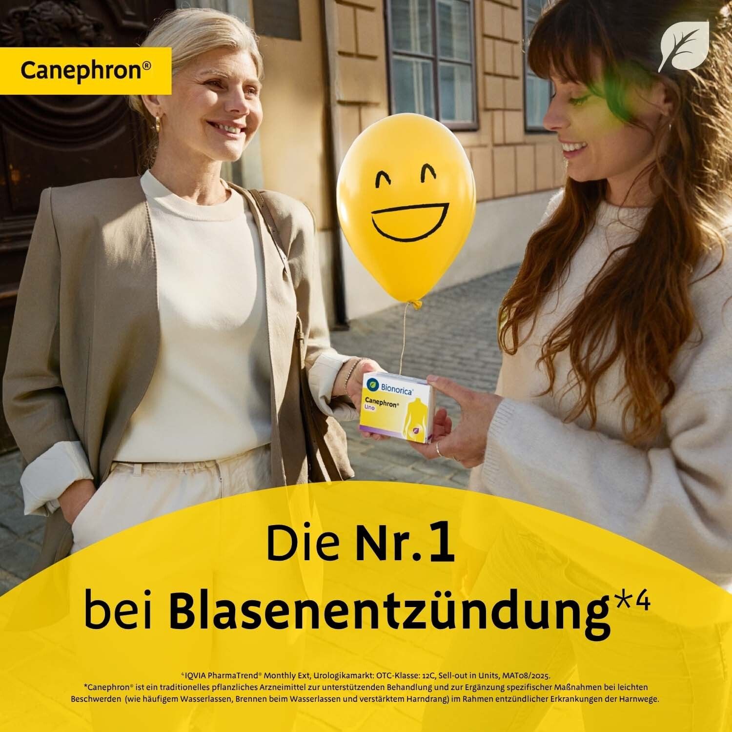 Zwei Frauen mit Ballon und Schachtel Canephron® Uno. Text: Die Nr.1 bei Blasenentzündung.