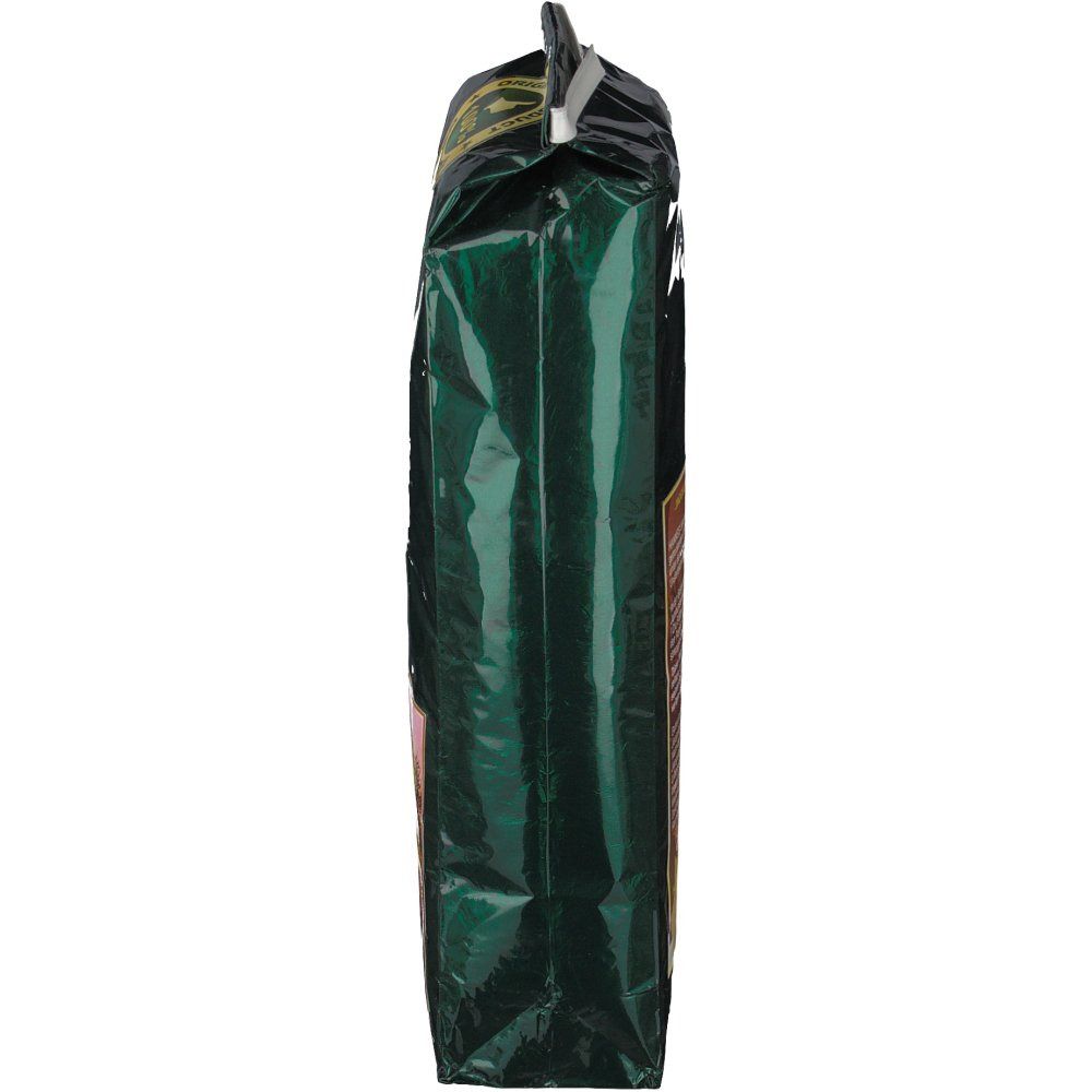 Schmale, grüne Verpackung. Seitenansicht. Oben mit weißem Verschluss. Aufdruck teilweise sichtbar.