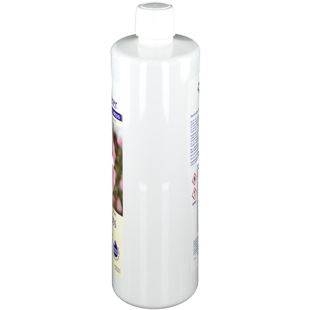 Weiße Flasche mit weißem Deckel. Auf der Seite ein Etikett mit Text und Symbolen. Blickwinkel von der Seite.