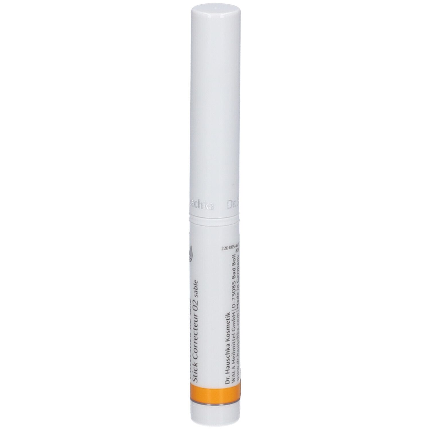 Weißer Stift mit orangefarbenem Streifen. Beschriftung: Stick Correcteur 02 sable. Herstellerinformationen.