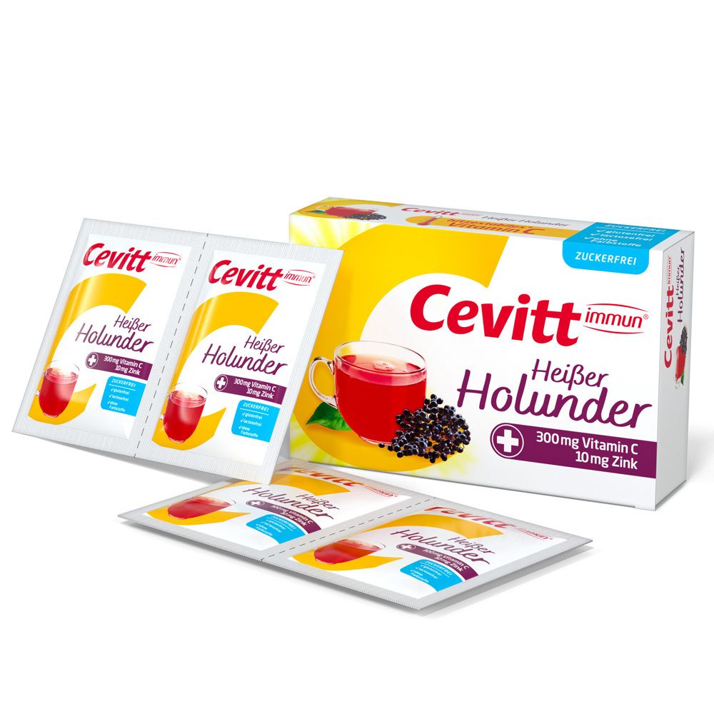 Cevitt immun® Heißer Holunder zuckerfrei. Packung und Einzelbeutel. Produktabbildung, Glas, Holunderbeeren.