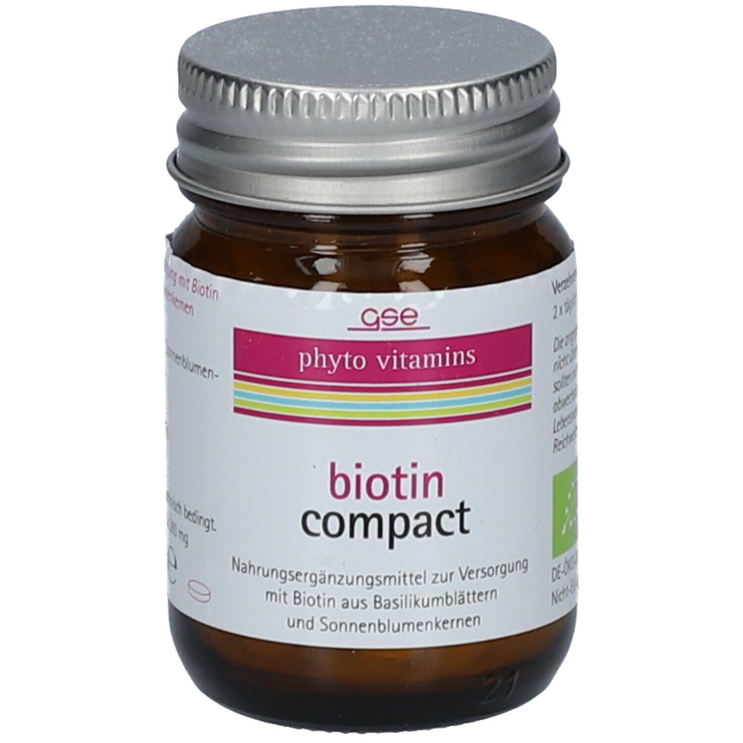 Braune Glasflasche mit silbernem Deckel. Etikett mit "phyto vitamins" und "biotin compact".