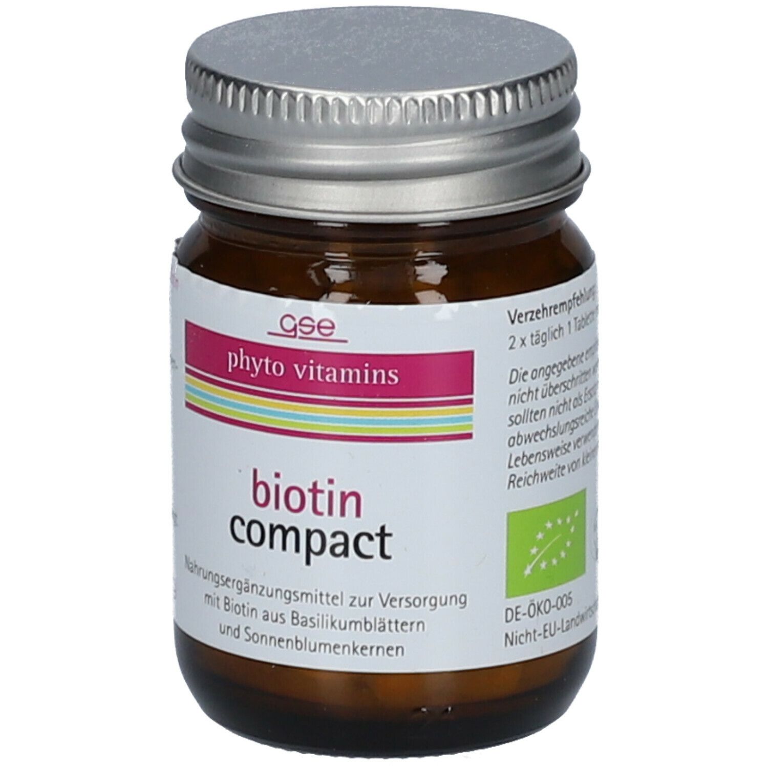 Braune Glasflasche mit silbernem Deckel. Etikett mit "phyto vitamins" und "biotin compact". Bio-Siegel.