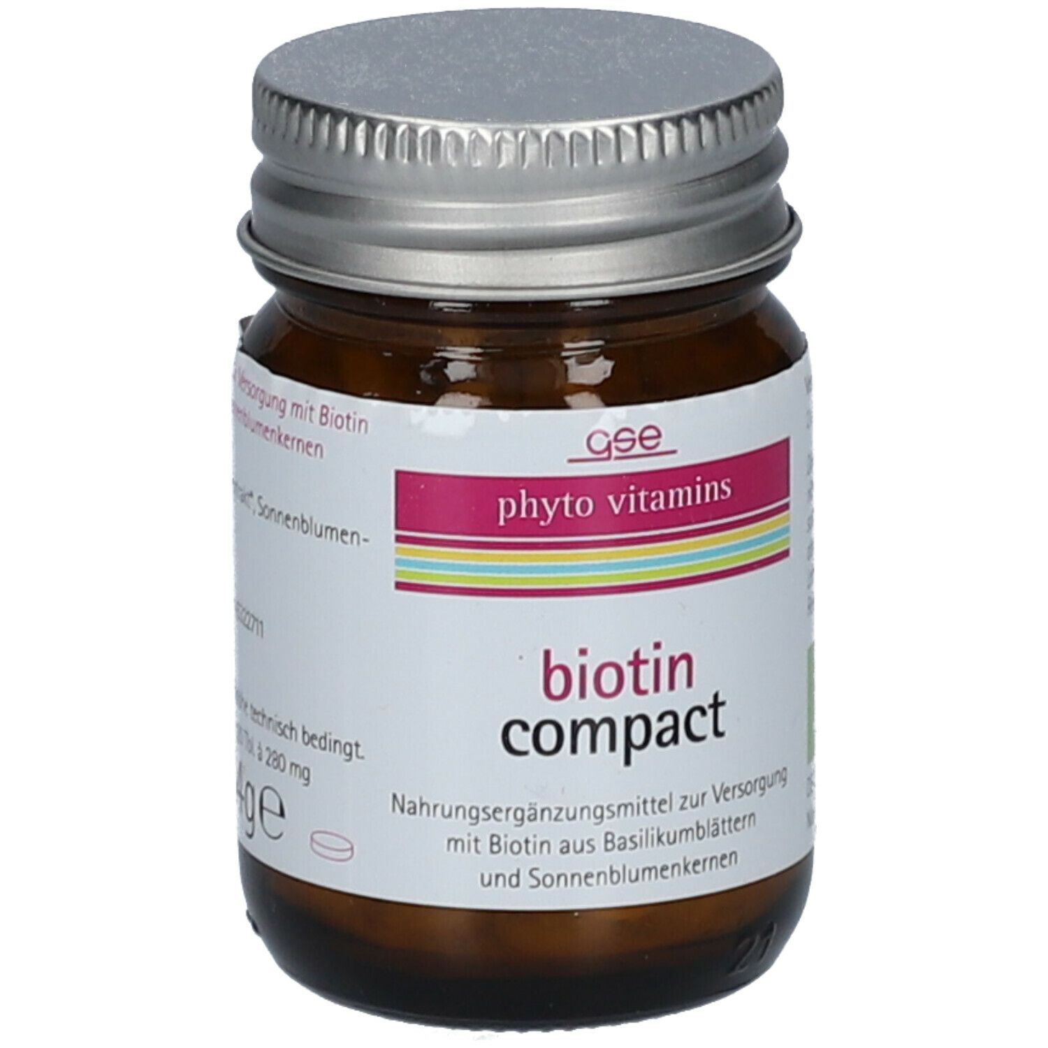 Braune Glasflasche mit silbernem Deckel. Etikett mit "phyto vitamins" und "biotin compact".