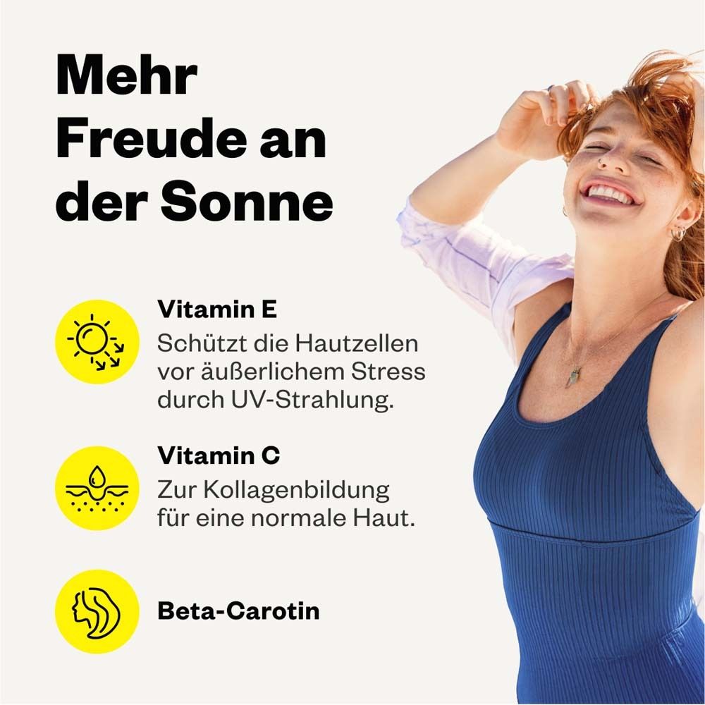 Frau lächelt. Text: Mehr Freude an der Sonne. Vitamin E, C und Beta-Carotin.