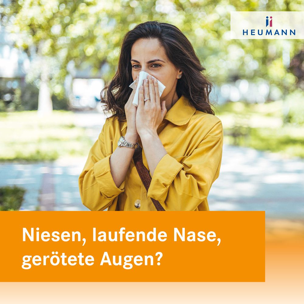 Frau mit Taschentuch vor dem Gesicht. Text: Niesen, laufende Nase, gerötete Augen? Marke: Heumann.