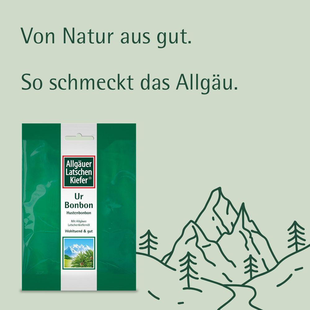 Grüne Verpackung mit "Allgäuer Latschenkiefer Ur Bonbon". Berge im Hintergrund.