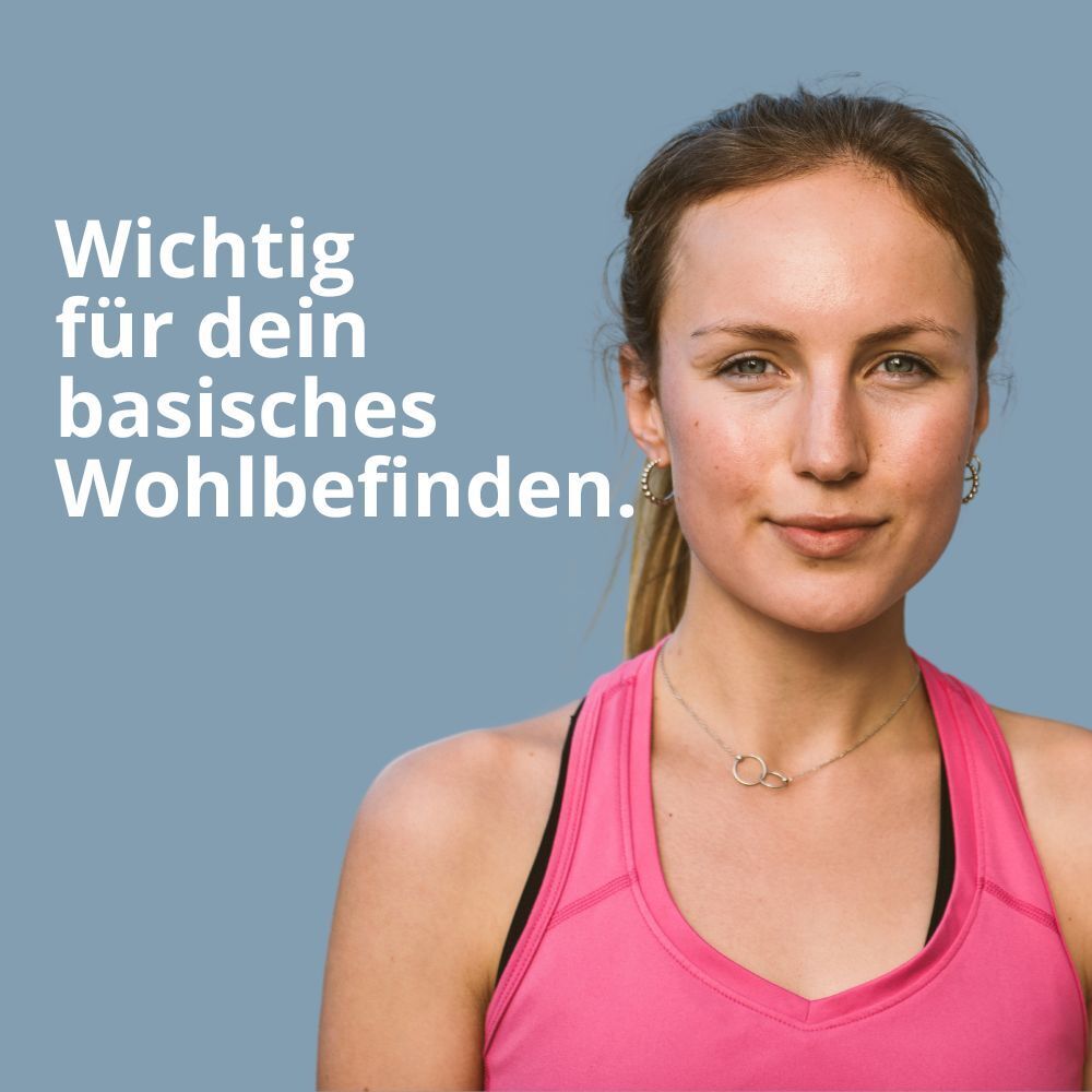 Porträt einer Frau in rosa Sporttop. Text: Wichtig für dein basisches Wohlbefinden.