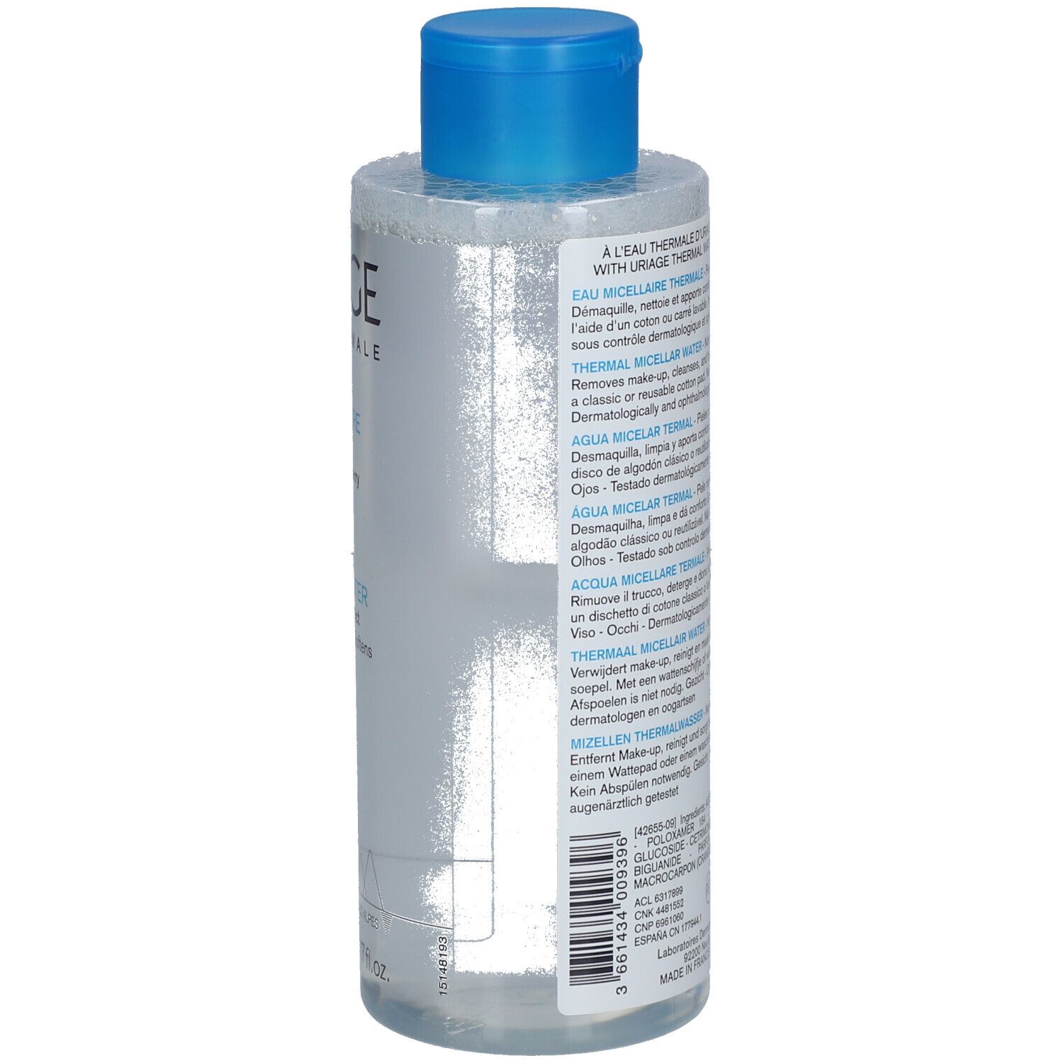 Rückseite einer transparenten Flasche mit blauem Deckel. Produktinformationen in verschiedenen Sprachen. Aufschrift: URIAGE Eau Thermale.