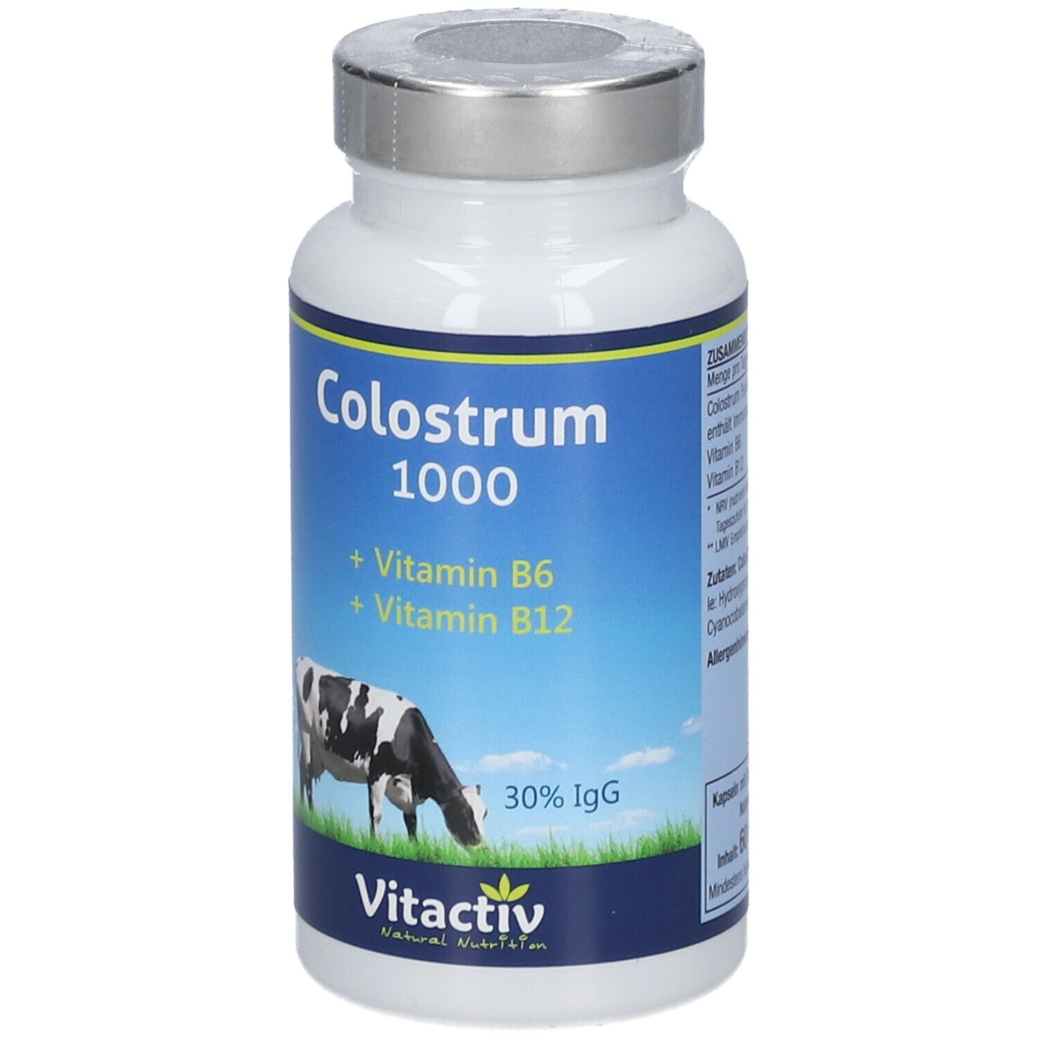 Weiße Flasche mit silbernem Deckel. Blaues Etikett mit Aufschrift: Colostrum 1000, Vitamine B6, B12. Kuh-Illustration.