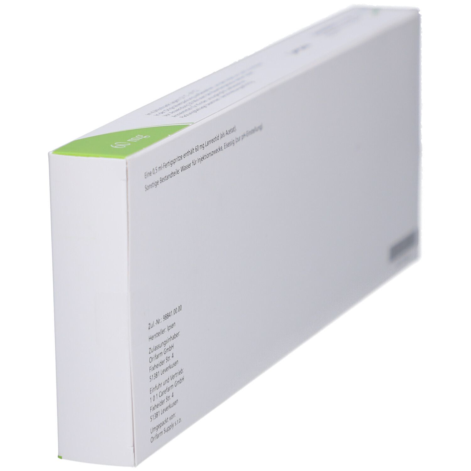 Weiße Schachtel, grüne Ecke. Text. Herstellerinformationen. Seitenansicht.