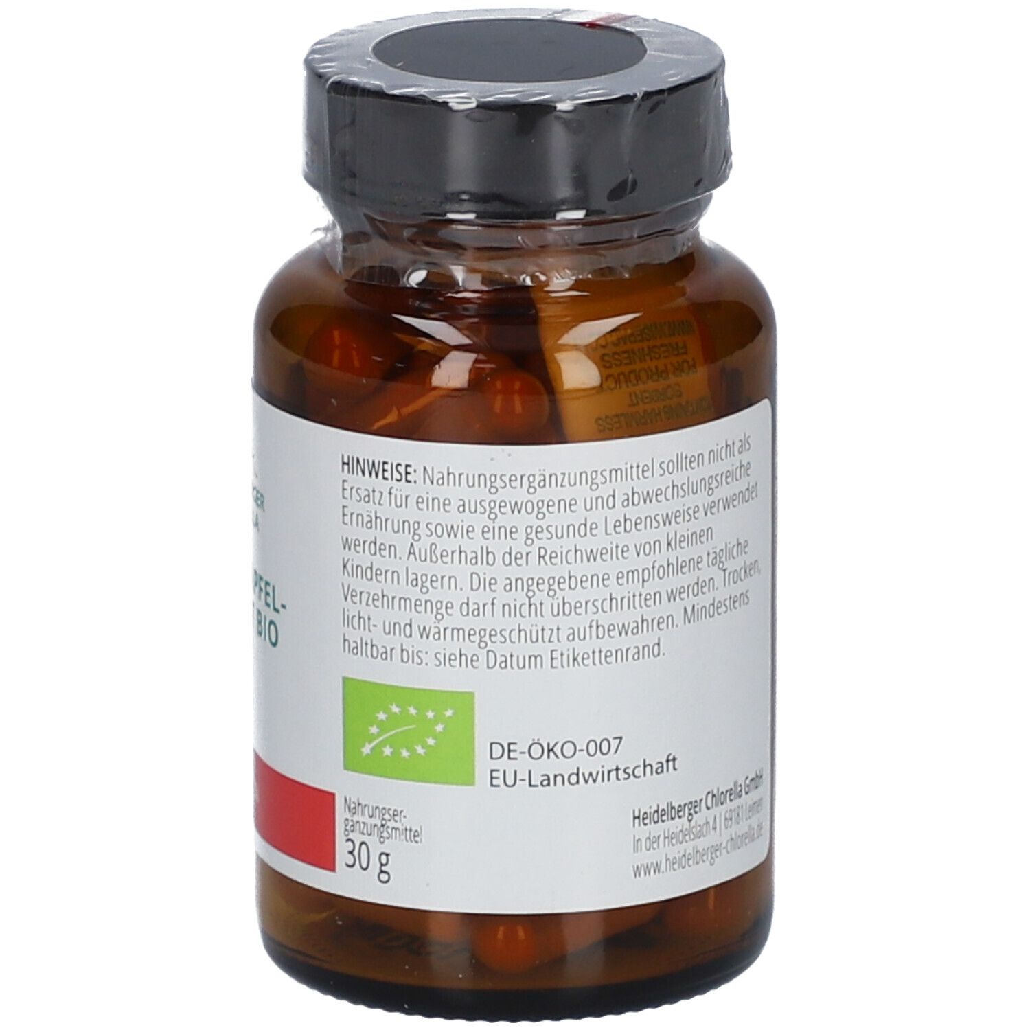 Braune Kapseln in einer braunen Glasflasche. Aufschrift: Heidelberger Chlorella, Granatapfel-Extrakt BIO. Etikett mit Hinweisen und Bio-Siegel.