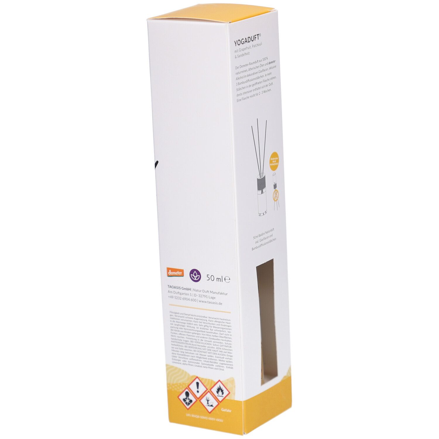 Produktverpackung mit Sichtfenster. Innenliegend: Flasche und Diffusor-Stäbchen. Text: "Yoga duft". Demeter-Siegel.