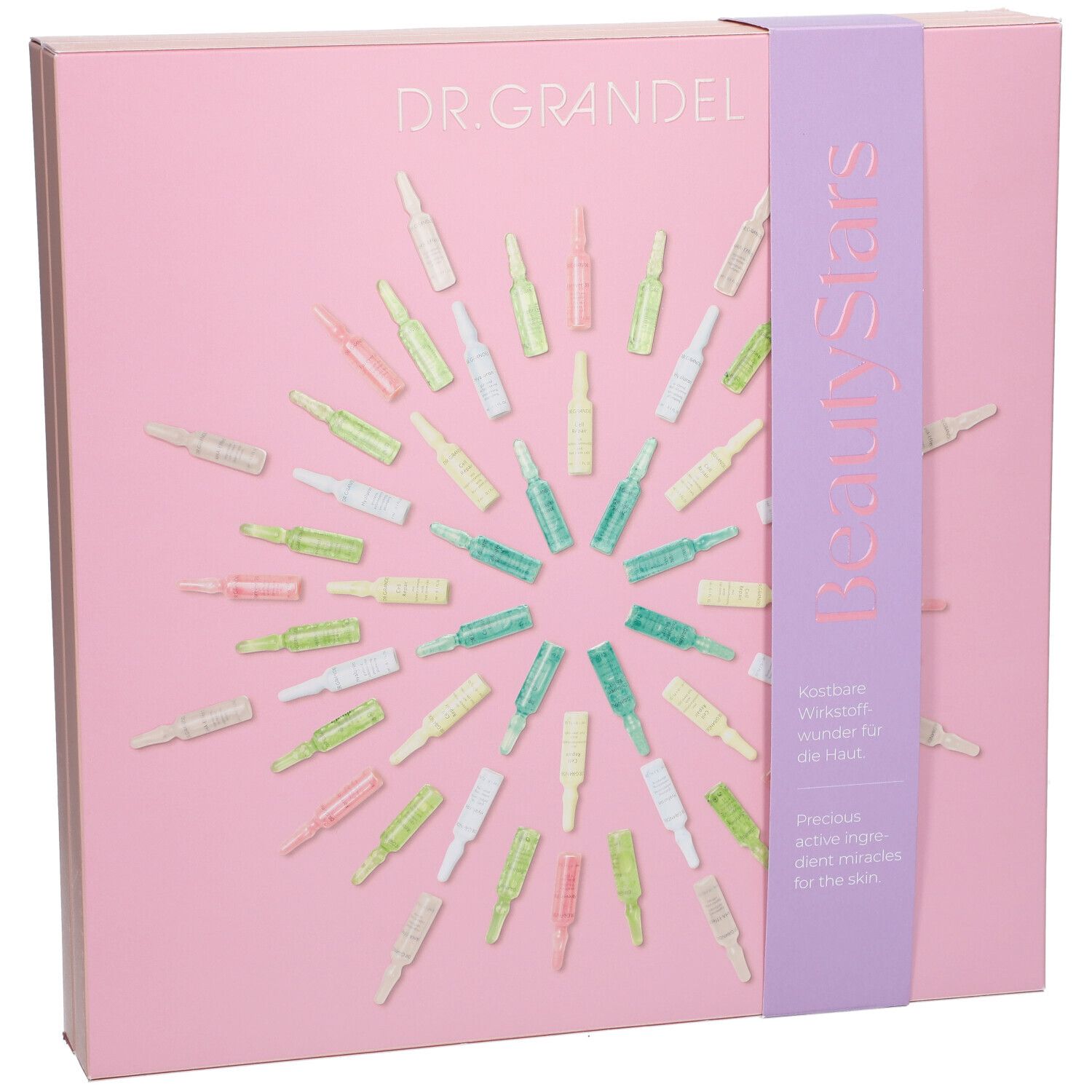 Rosa Geschenkbox mit Ampullen. Aufschrift DR. GRANDEL und BeautyStars. Lila Band mit Text. Ampullen in verschiedenen Farben angeordnet.