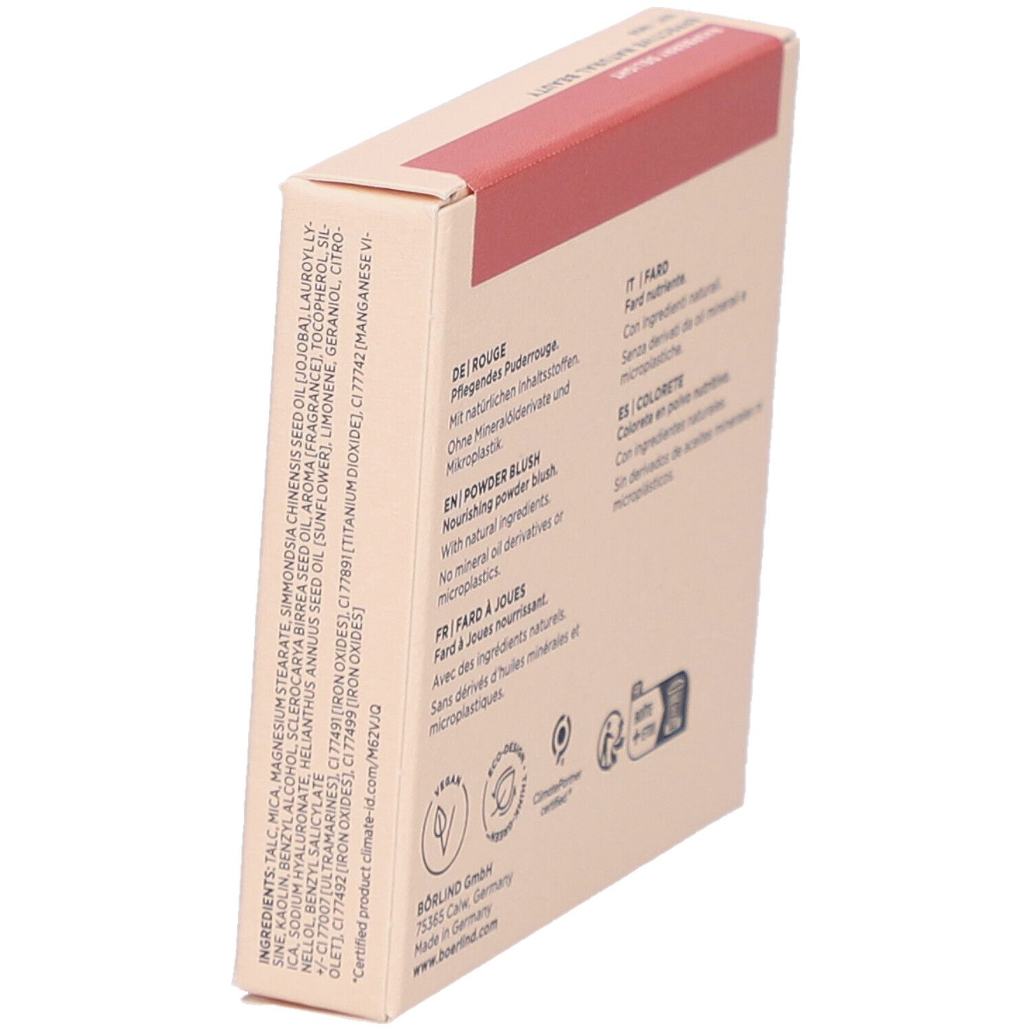 Schräg stehende Kartonverpackung. Rückseite mit Inhaltsstoffen und Text in mehreren Sprachen. Logos.