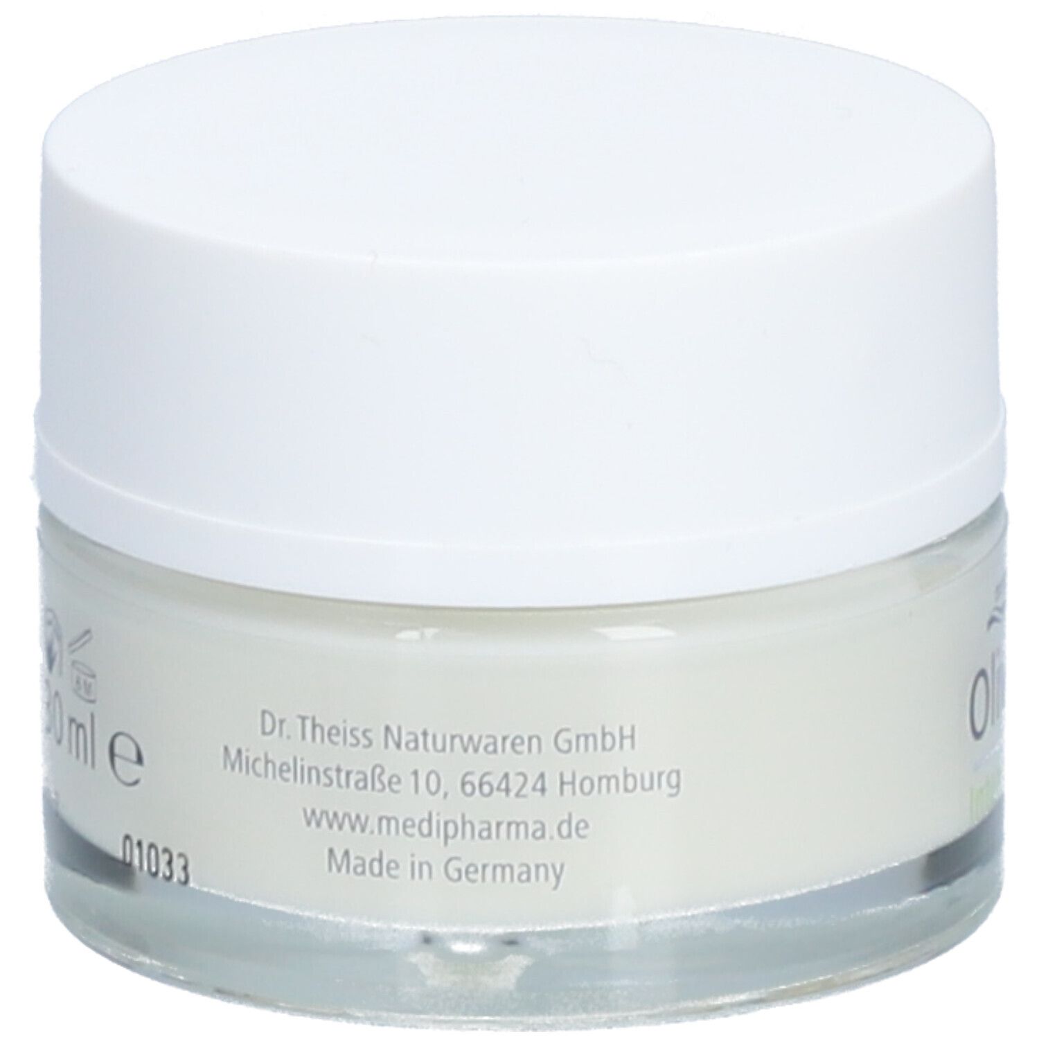 Rückseite eines Creme-Tiegels mit weißem Deckel. Aufgedruckt sind Informationen zu Hersteller und Inhaltsstoffen.