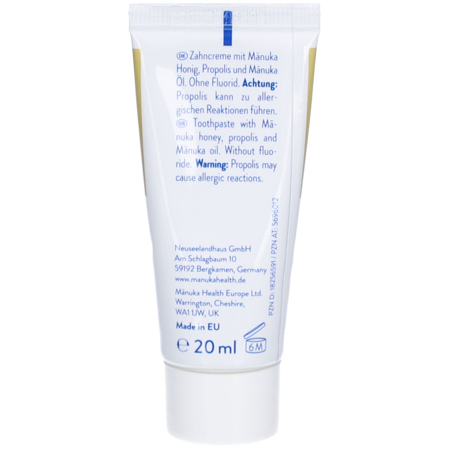 Rückseite der Zahncreme-Tube. Enthält Text in Deutsch und Englisch. Informationen zu Inhaltsstoffen und Hersteller.