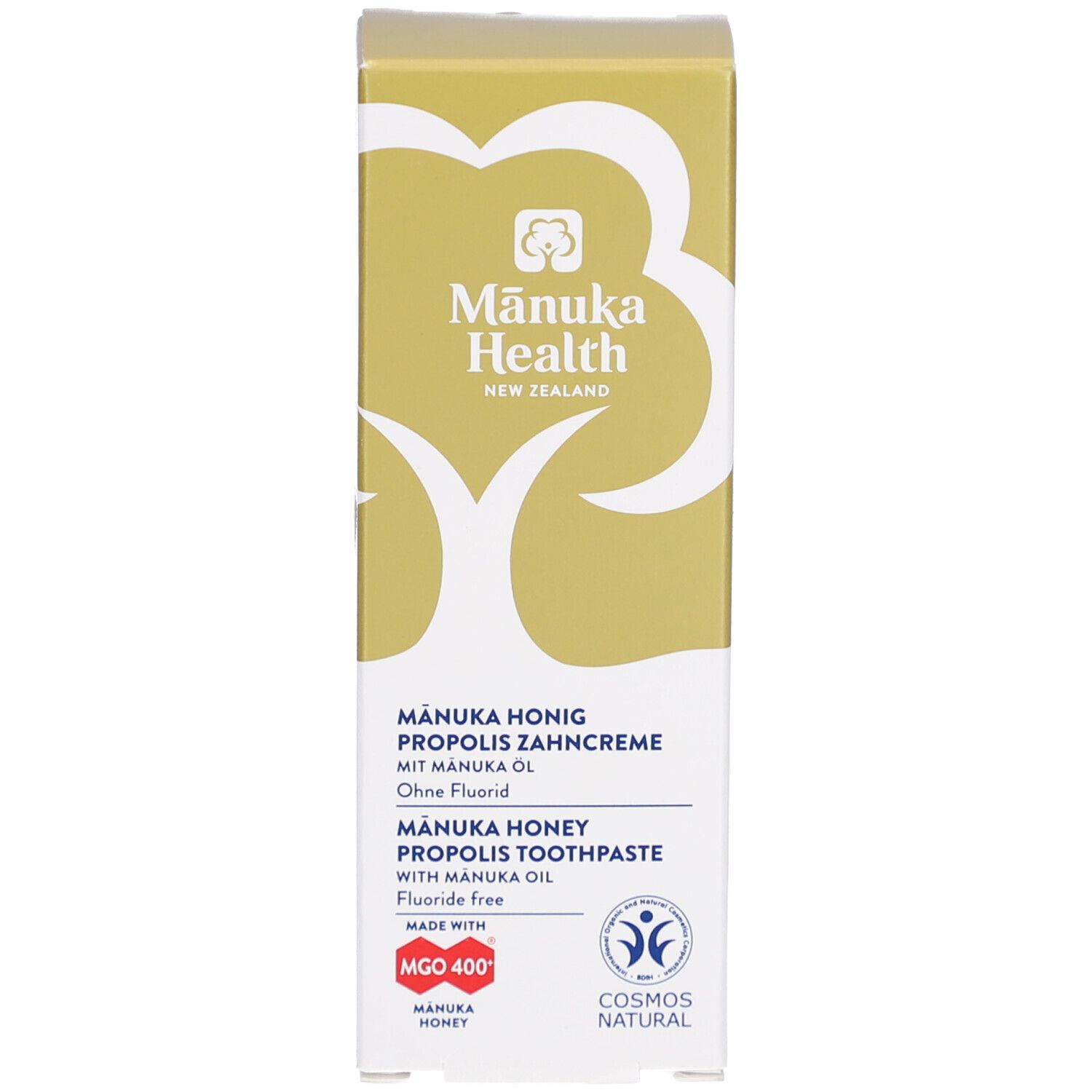 Kartonverpackung für Zahncreme. Zeigt Produktnamen, Logos und Zertifizierungen. Enthält Manuka Honig, Propolis und Öl. Fluoridfrei.