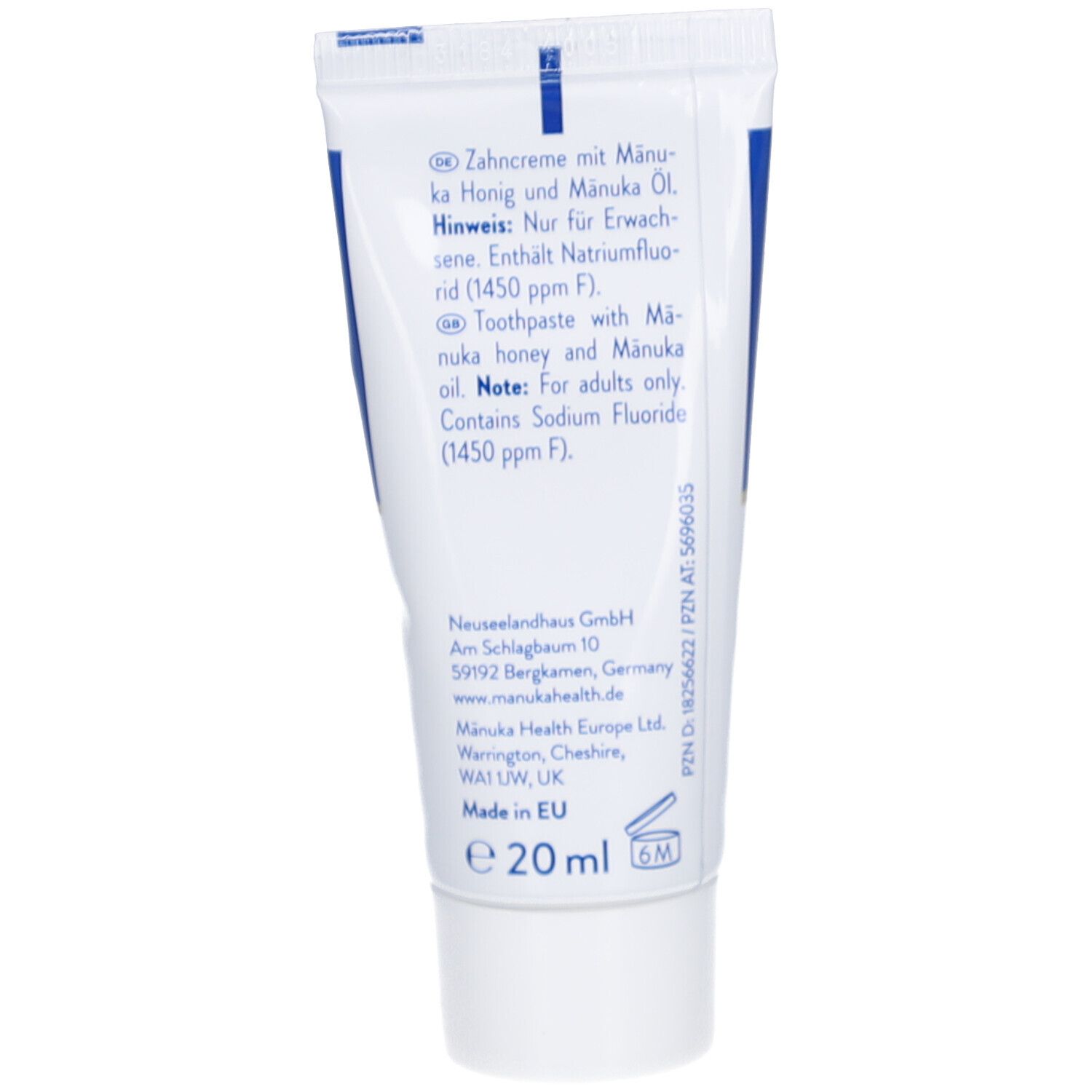 Rückseite der Zahncreme-Tube. Enthält Informationen zu Inhaltsstoffen und Hersteller. Text in Deutsch und Englisch.