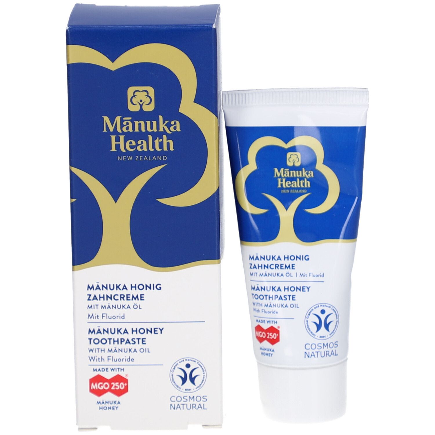 Zahncreme-Tube und Schachtel. Blau-weißes Design mit Logo und Schriftzug. Enthält Manuka-Honig und Fluorid. COSMOS NATURAL-Zertifizierung.