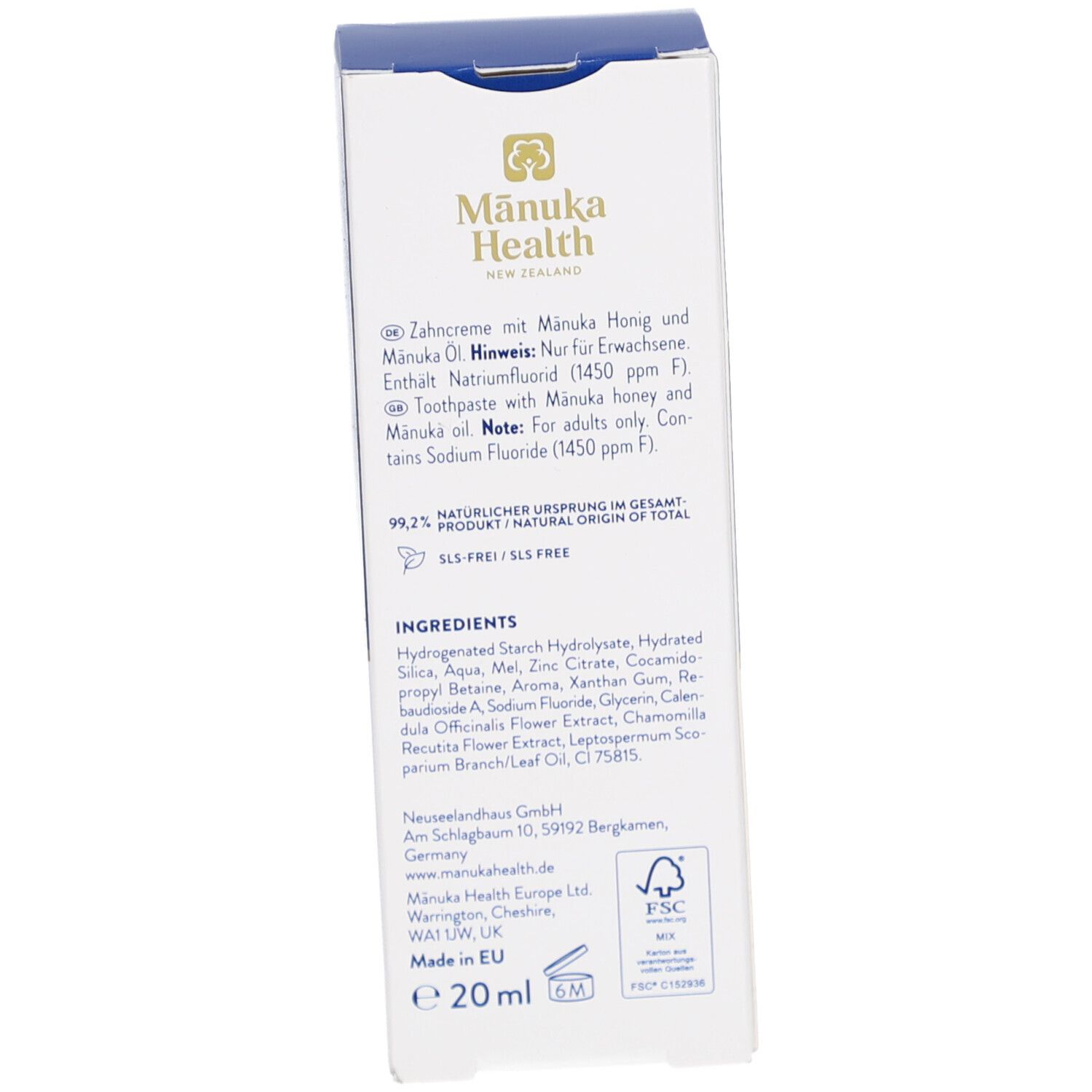 Rückseite der Zahncreme-Schachtel. Enthält Informationen zu Inhaltsstoffen und Hersteller. Text in Deutsch und Englisch.