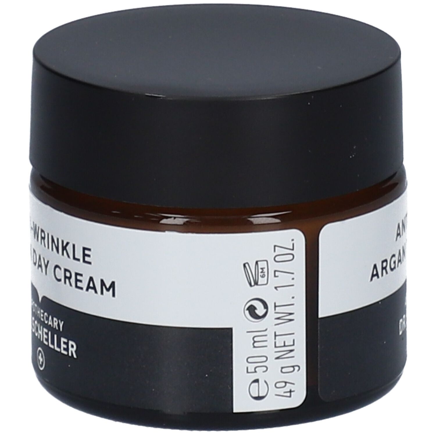 Braunes Creme-Glas mit schwarzem Deckel. Produktname und Logo auf dem Etikett. Vegan-Siegel.